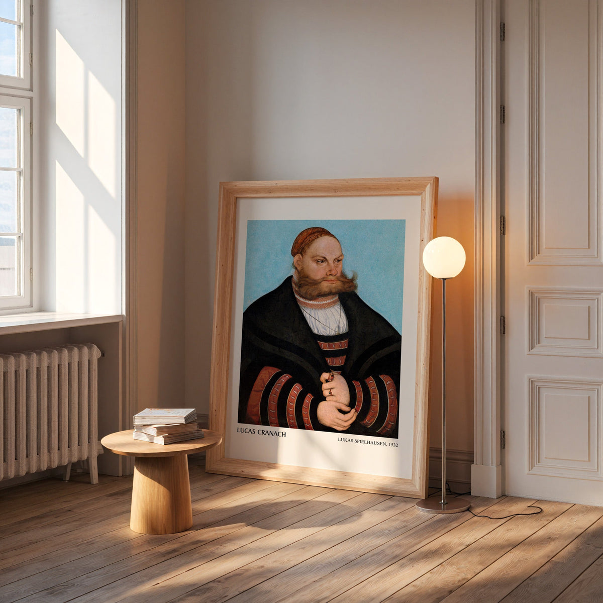 Cranach portrait print in a wide pine frame leaning by a sunlit window