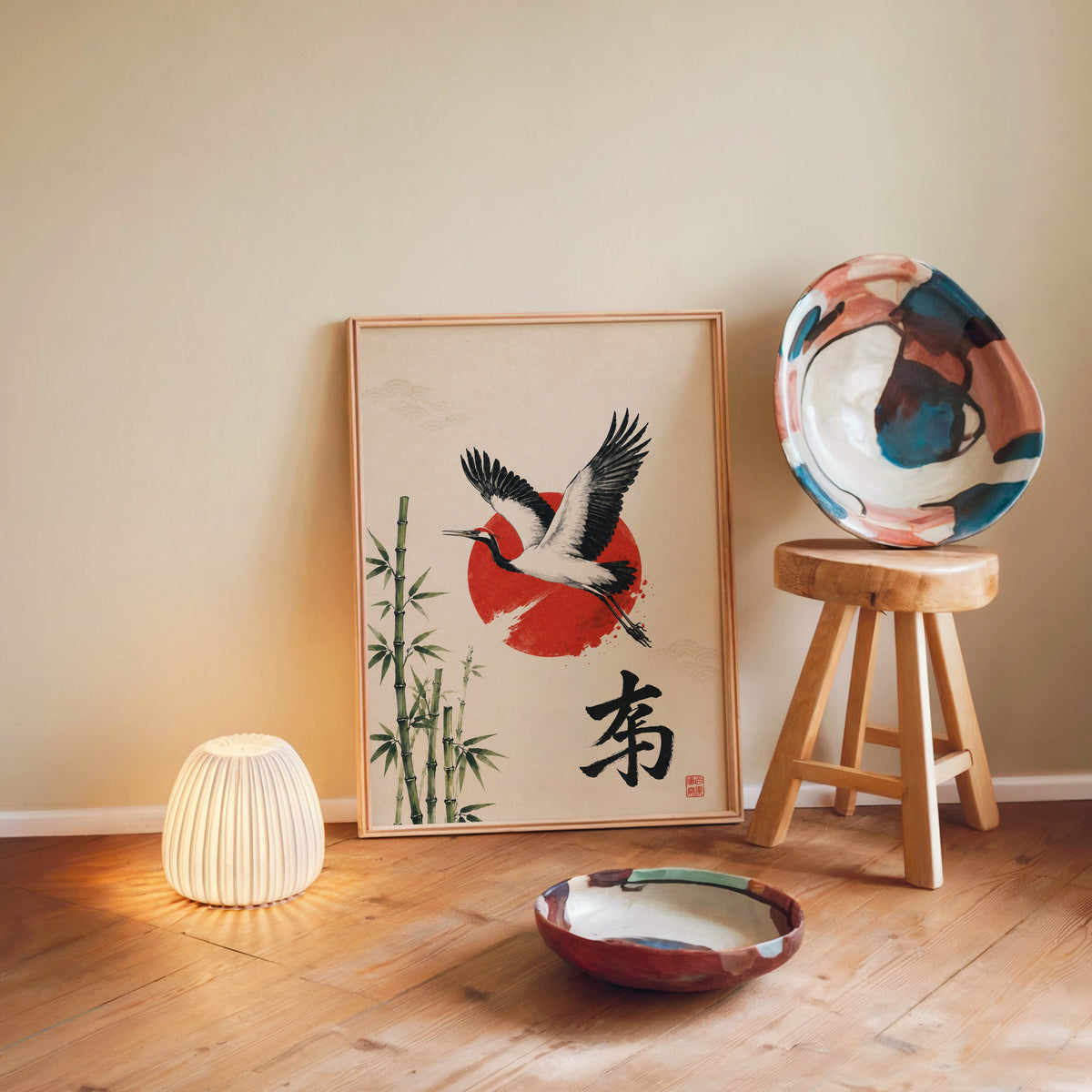 Crane bamboo red sun poster in a light wood frame leaning on a wooden floor by a glowing lamp and stool