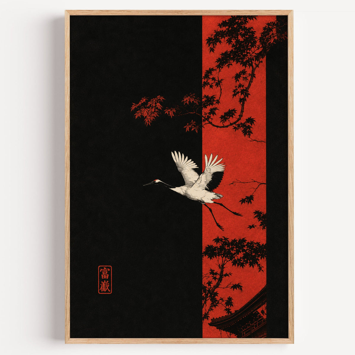 white crane and red maple print in a light oak frame on a plain white wall