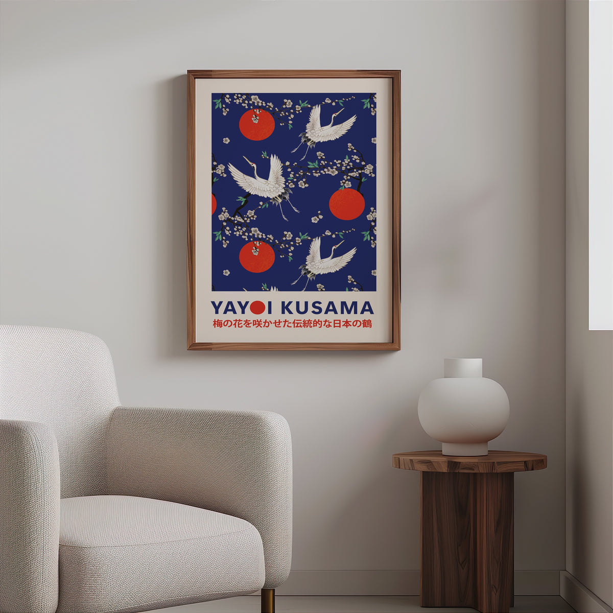Yayoi Kusama inspired cranes and plum blossom on cobalt print in a walnut frame above a boucle armchair