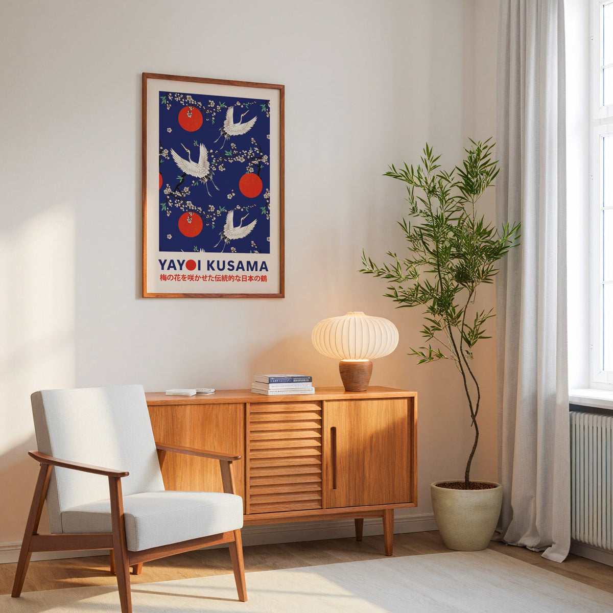 Yayoi Kusama inspired cranes and plum blossom on cobalt print in an oak frame above a mid century sideboard