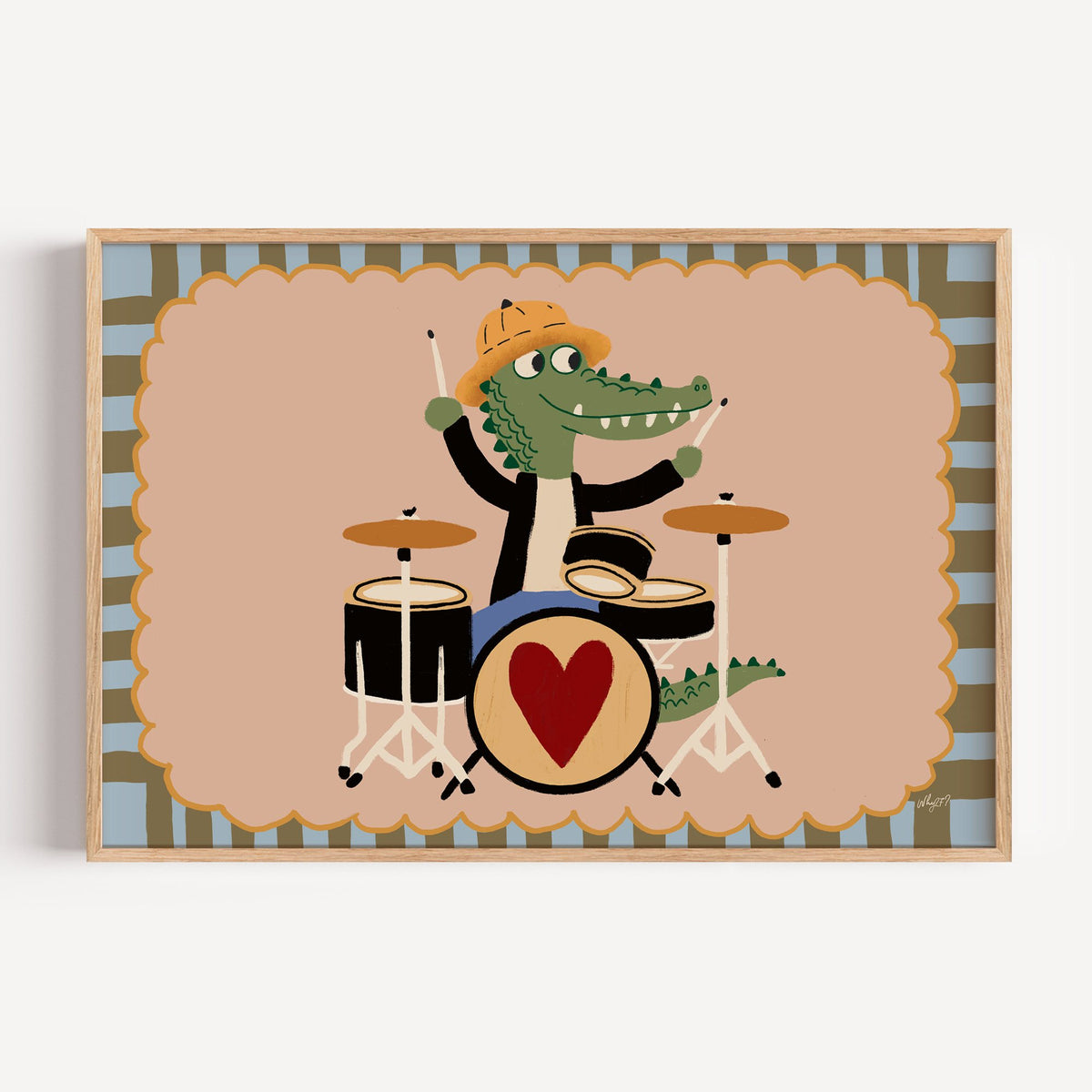 Crocodile playing heart drum kit nursery print in a light oak frame on a plain white wall