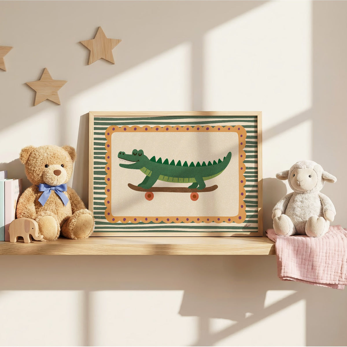 Smiling crocodile on skateboard nursery print in an oak frame on a wall shelf between a teddy bear and a toy lamb