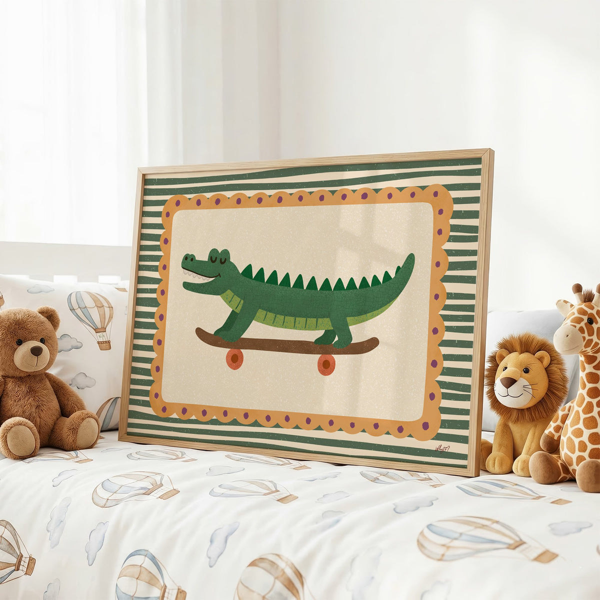 Smiling crocodile on skateboard nursery print in an oak frame on a kids bed with hot air balloon bedding