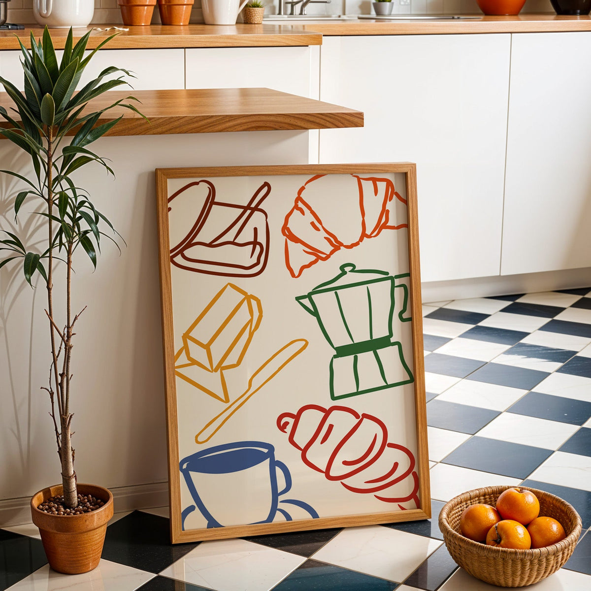 Croissant and coffee doodle print in an oak frame by a kitchen island and checkered floor