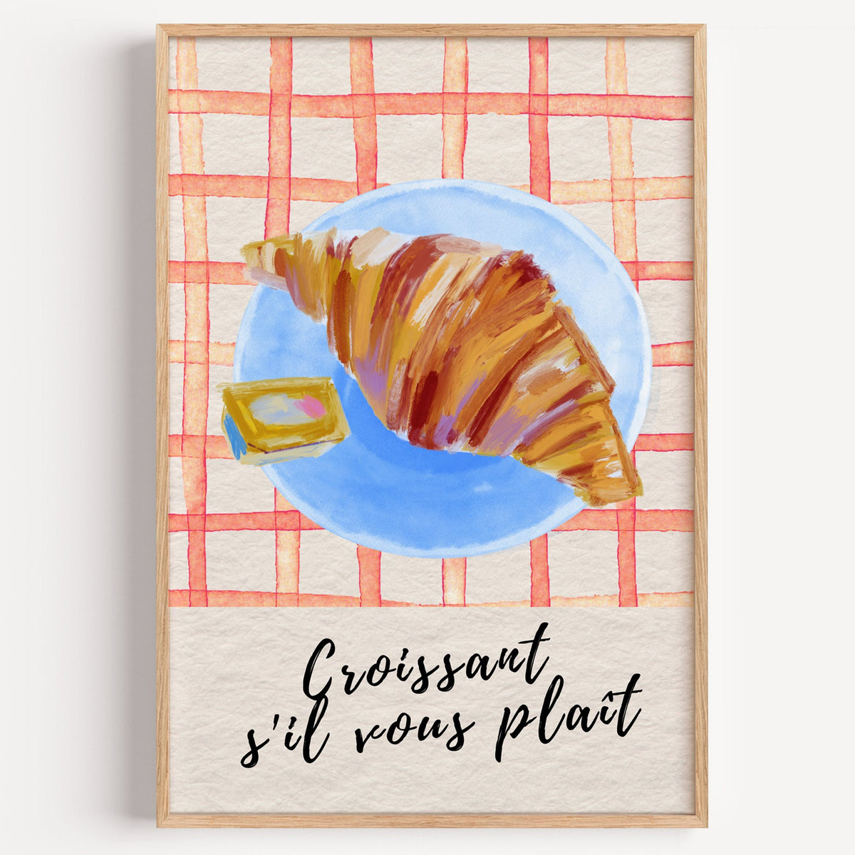 Croissant s'il vous plait blue plate print in a light oak frame on a plain white wall
