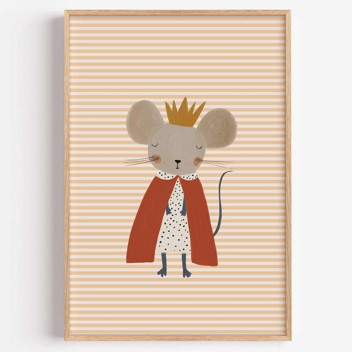 Crowned mouse red cape nursery print in a light oak frame on a plain white wall