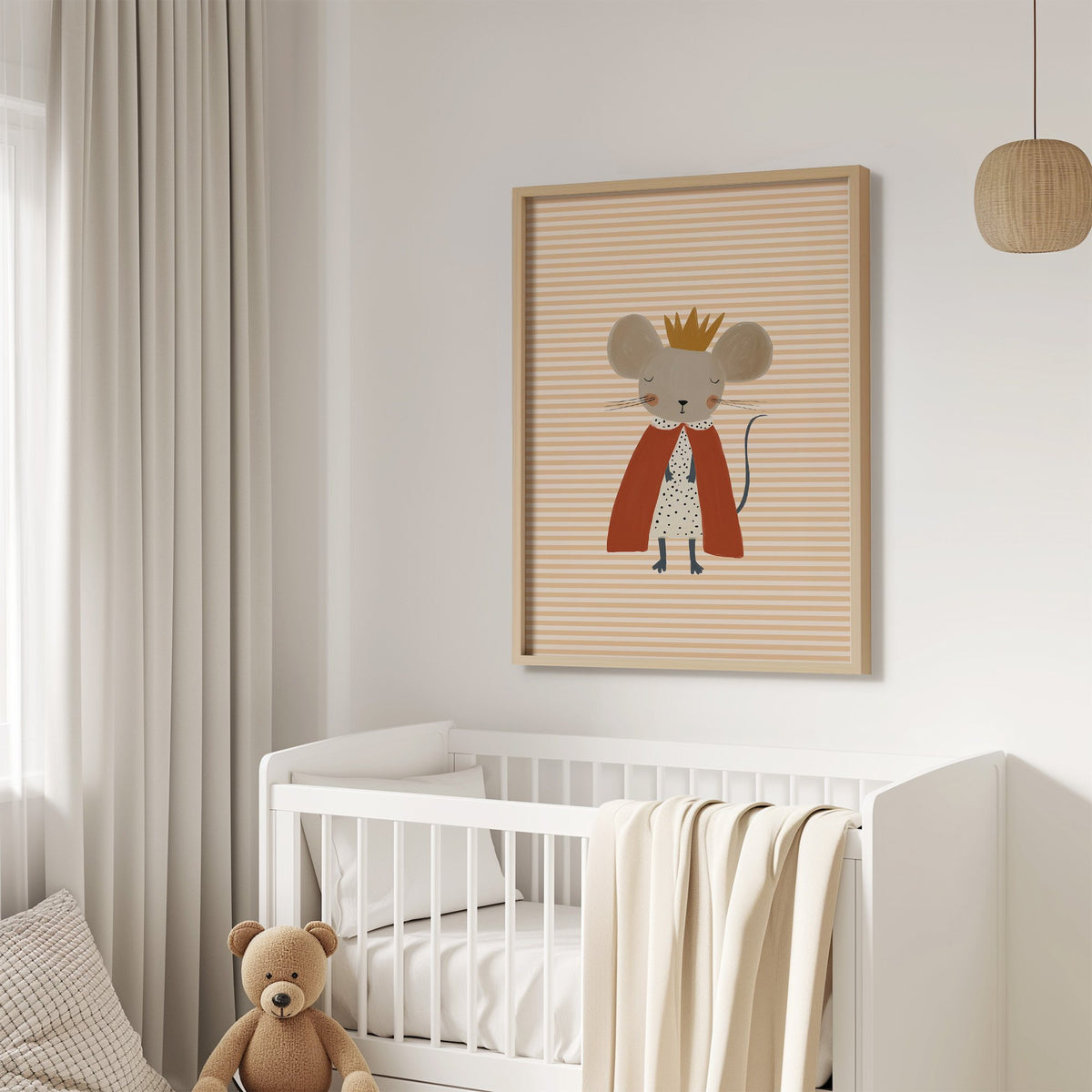 Crowned mouse red cape nursery print in an oak frame above a white crib with a teddy bear
