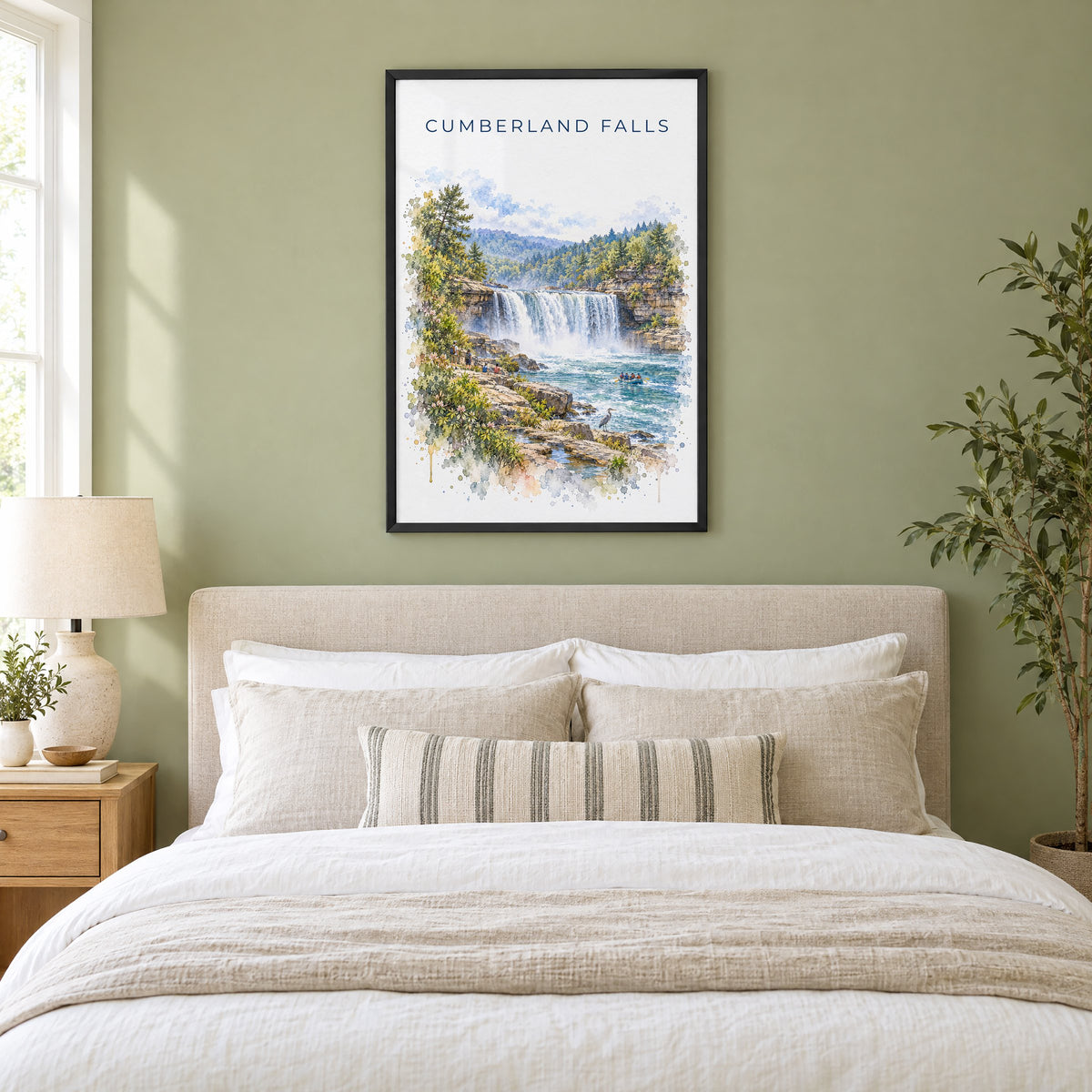 Cumberland Falls watercolor print in a black frame above an upholstered headboard in a sage green bedroom
