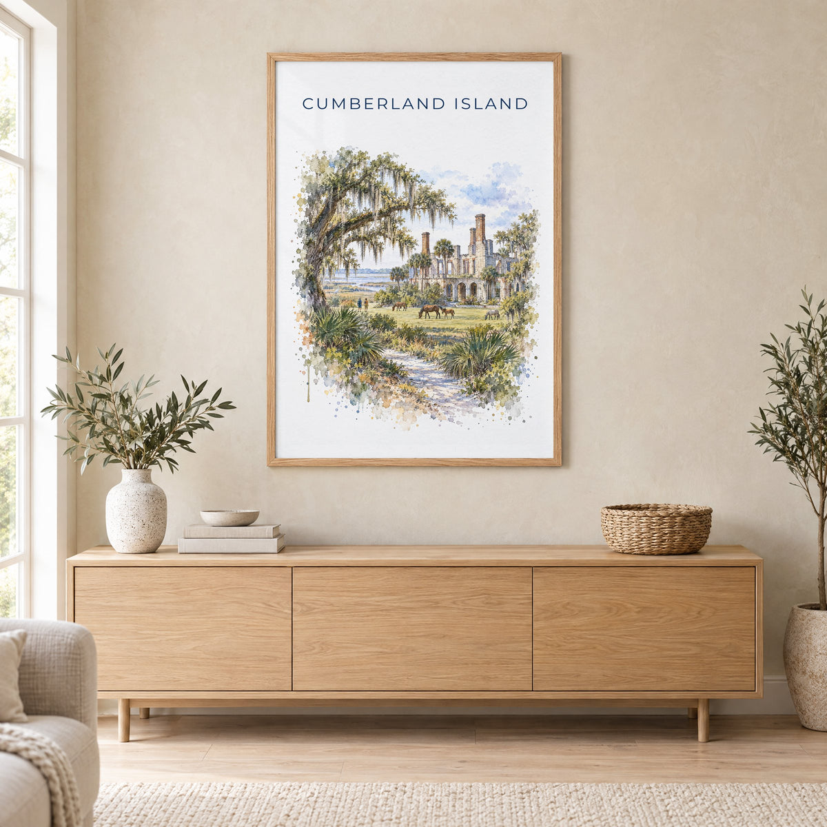 Cumberland Island watercolor print in an oak frame above a light wood sideboard in a Scandinavian living room