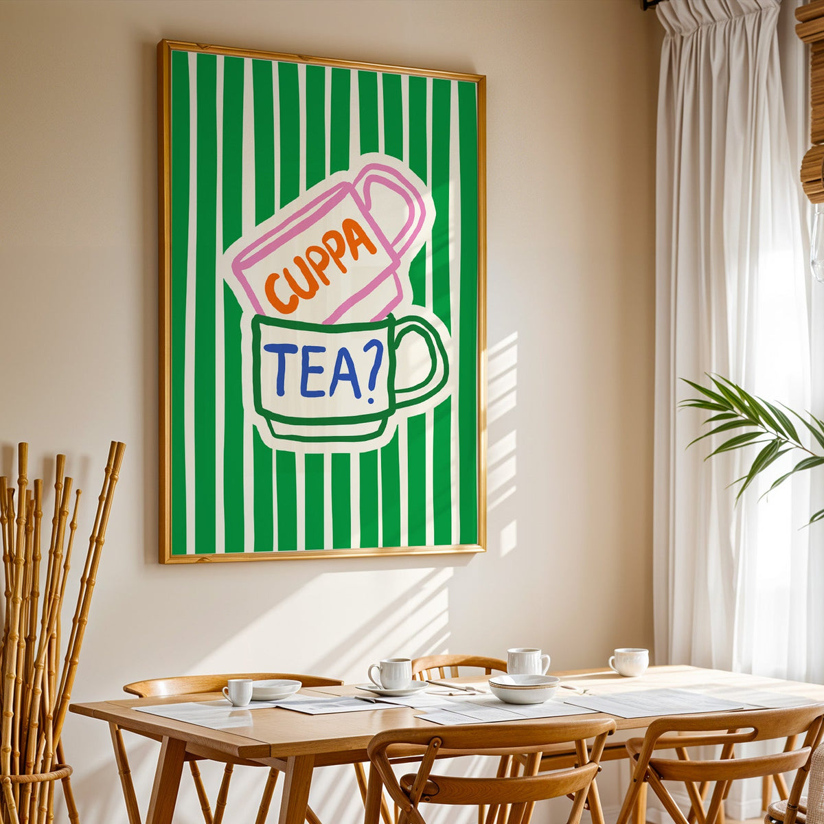 Cuppa tea print in a gold frame above a sunlit breakfast table