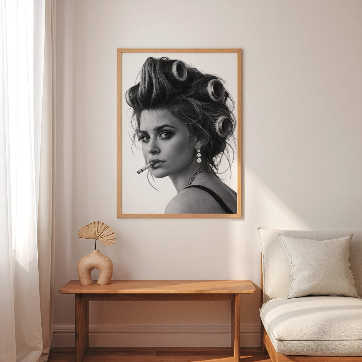 Woman in big curlers looking over shoulder print in an oak frame above a narrow console with an arched vase