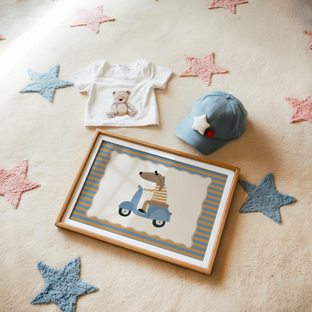 Landscape dachshund on blue scooter nursery print in a matted oak frame on a star rug with a baby tee