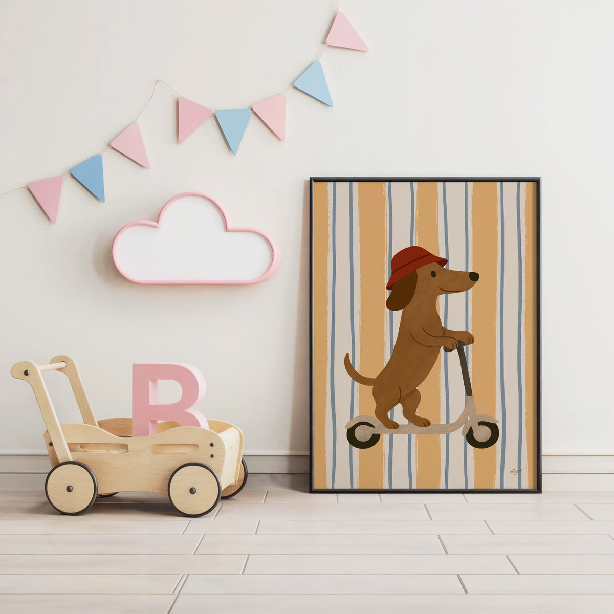 Dachshund riding scooter on stripes nursery print in a black frame under pastel bunting by a wooden baby walker