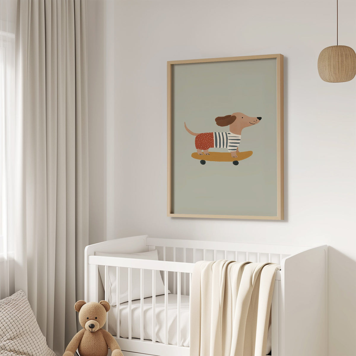 Dachshund skateboard sage nursery print in an oak frame above a white crib with a teddy bear