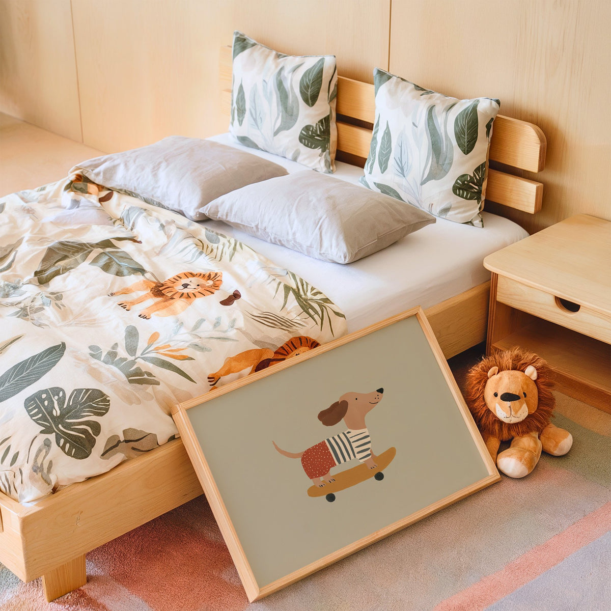 Landscape dachshund skateboard sage nursery print in an oak frame leaning on a kids bed by a lion plush