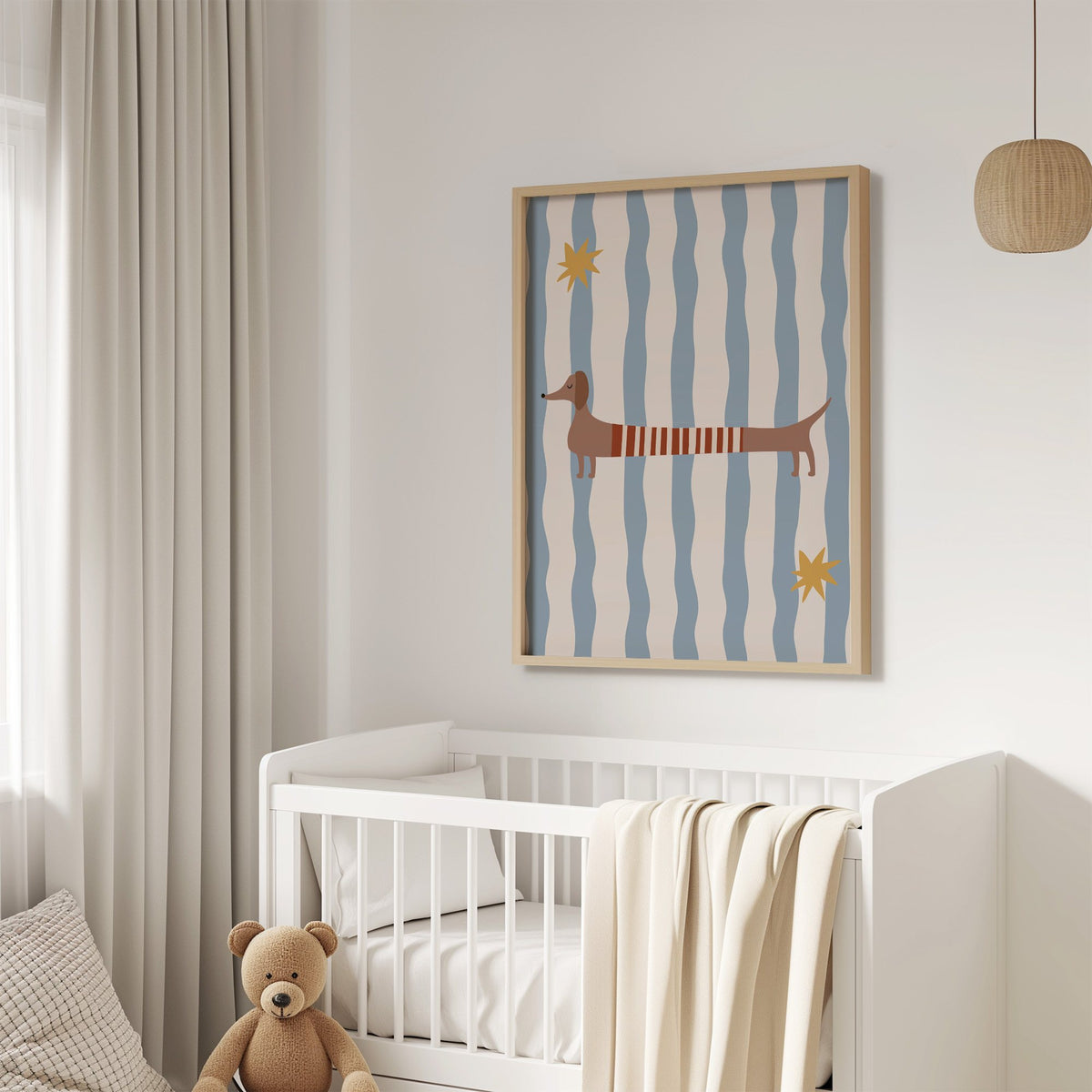 Dachshund red striped sweater nursery print in an oak frame above a white crib with a teddy bear