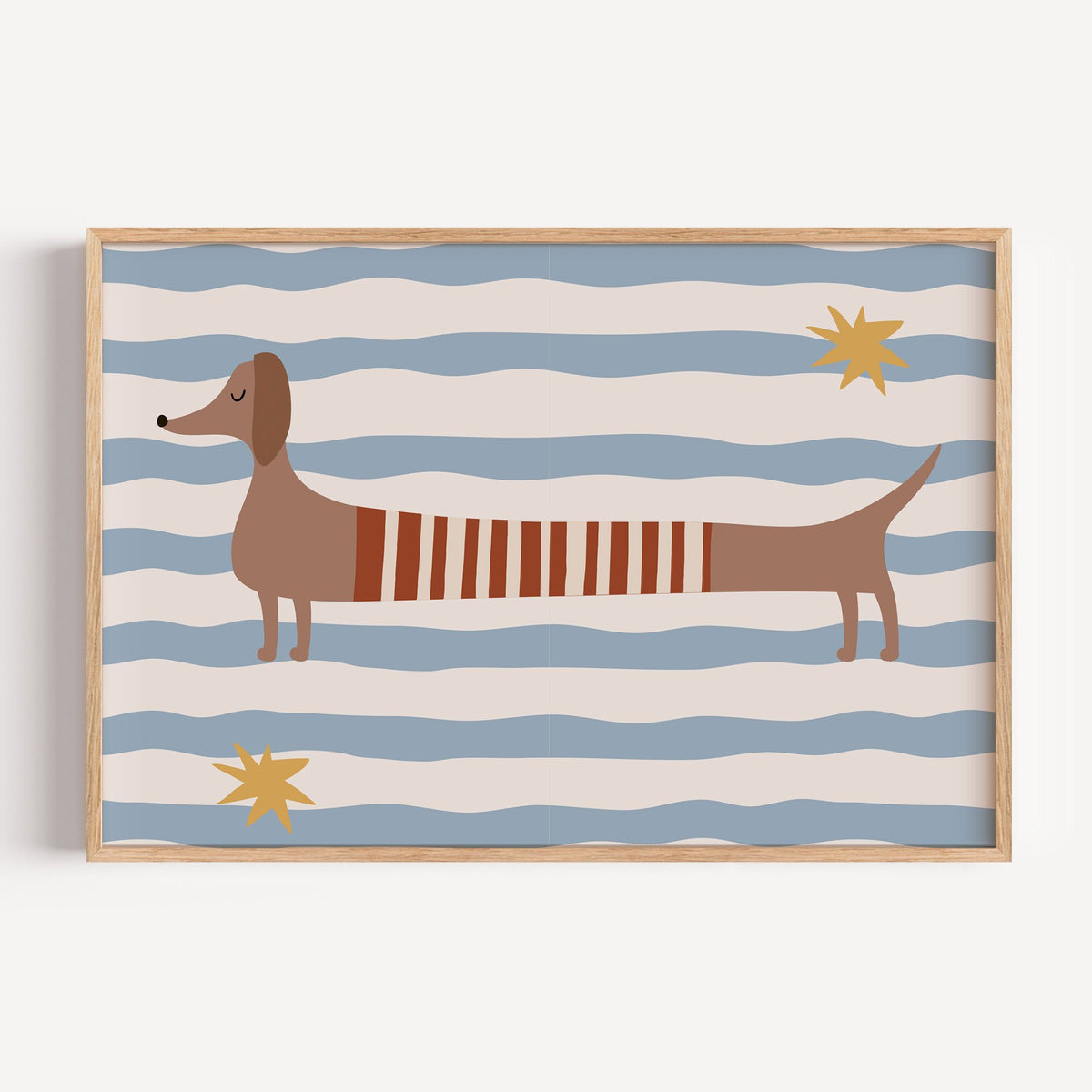 Landscape dachshund red striped sweater nursery print in a light oak frame on a plain white wall