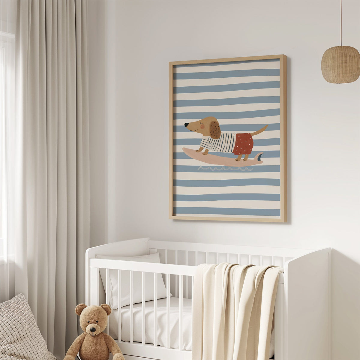 Dachshund on pink surfboard nursery print in an oak frame above a white crib with a teddy bear