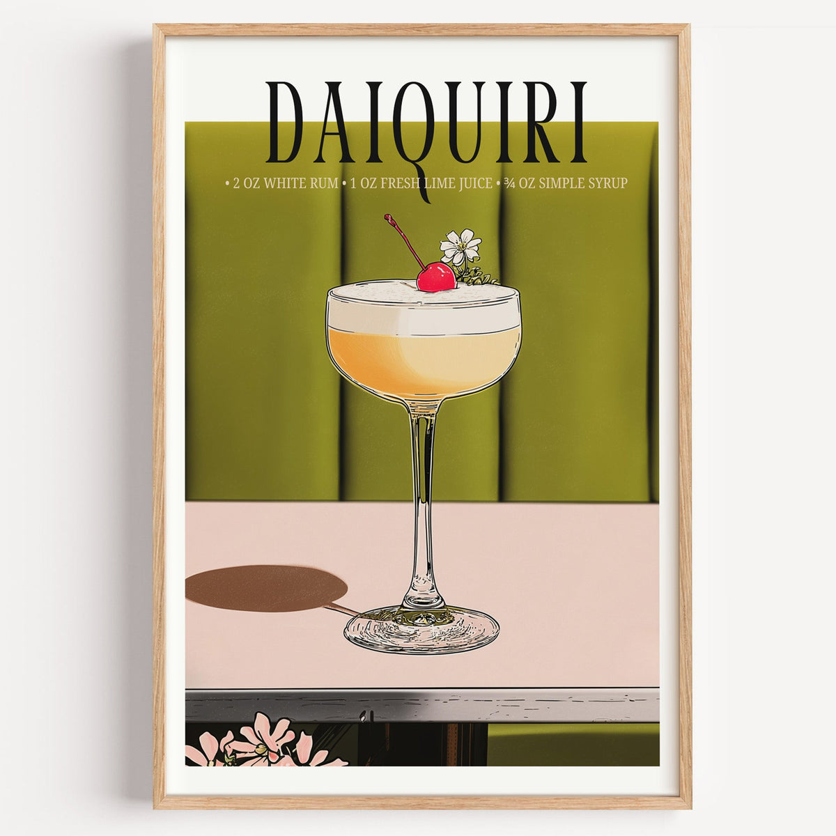 Daiquiri recipe print in a light oak frame on a plain white wall