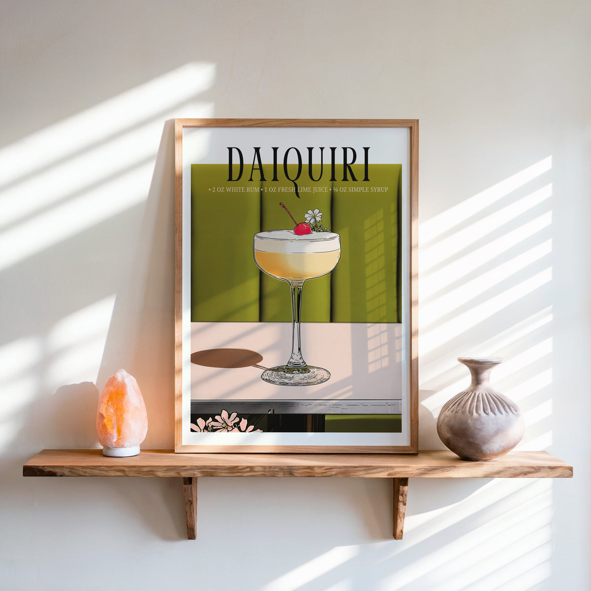 Daiquiri recipe print in an oak frame on a live-edge shelf beside a salt lamp