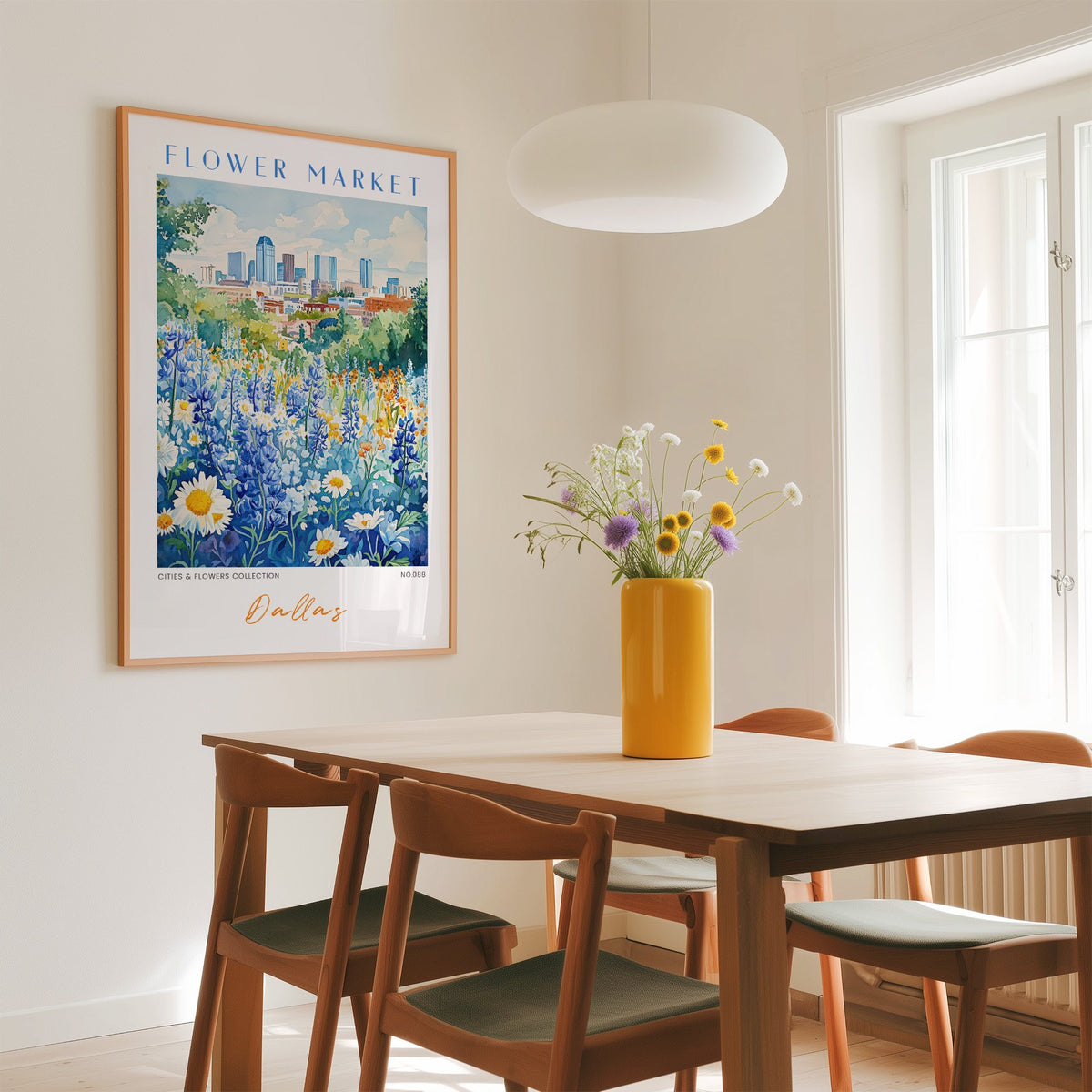 Dallas flower market print in an oak frame above a dining table with a yellow vase and white pendant light