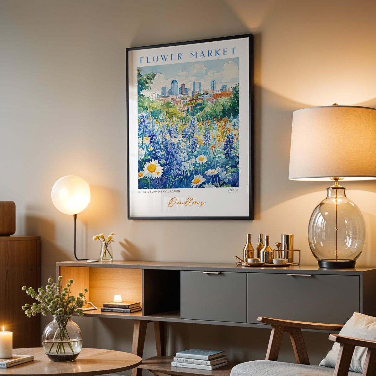 Dallas flower market print in a black frame above a grey media console with a glass table lamp