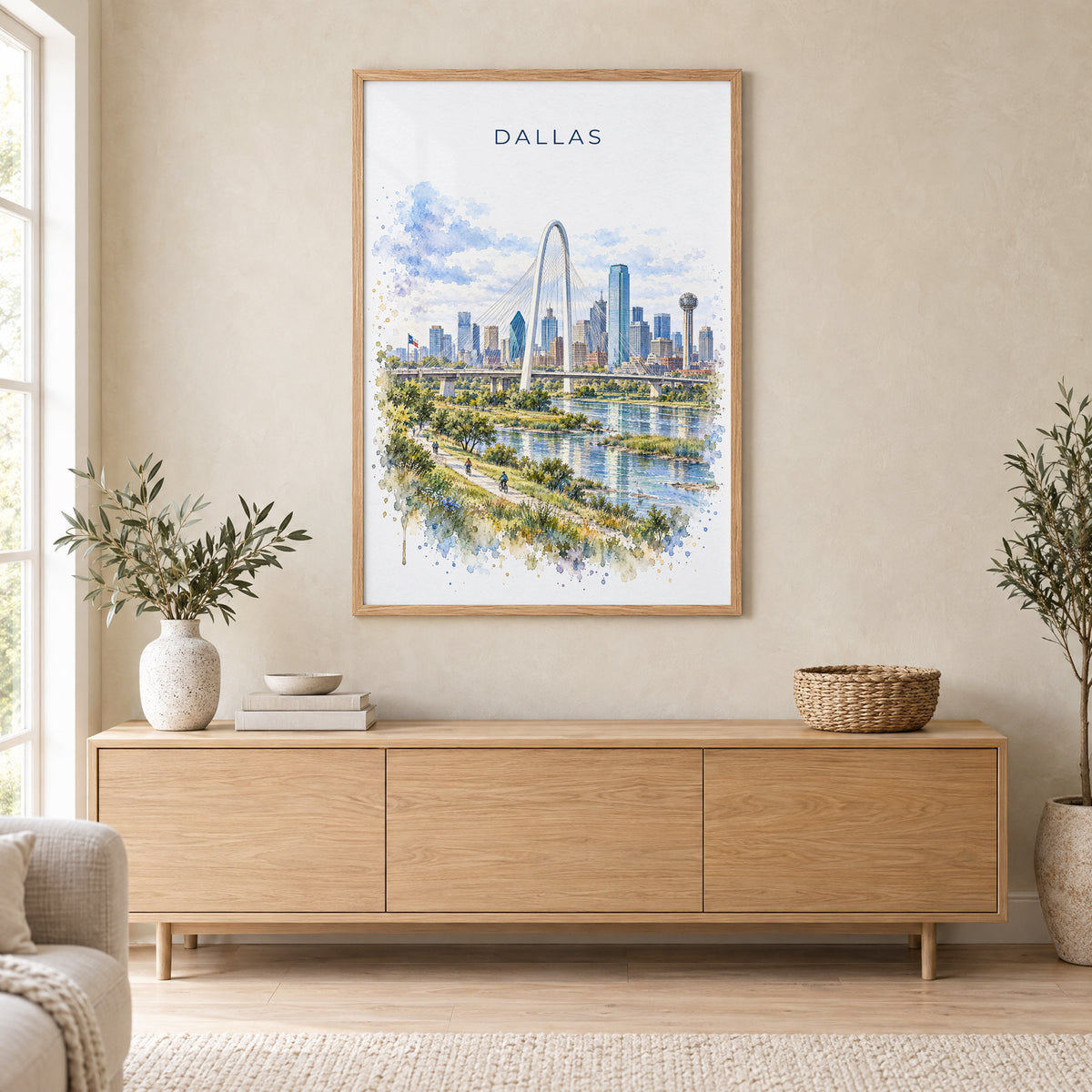 Dallas watercolor print in an oak frame above a light wood sideboard in a Scandinavian living room