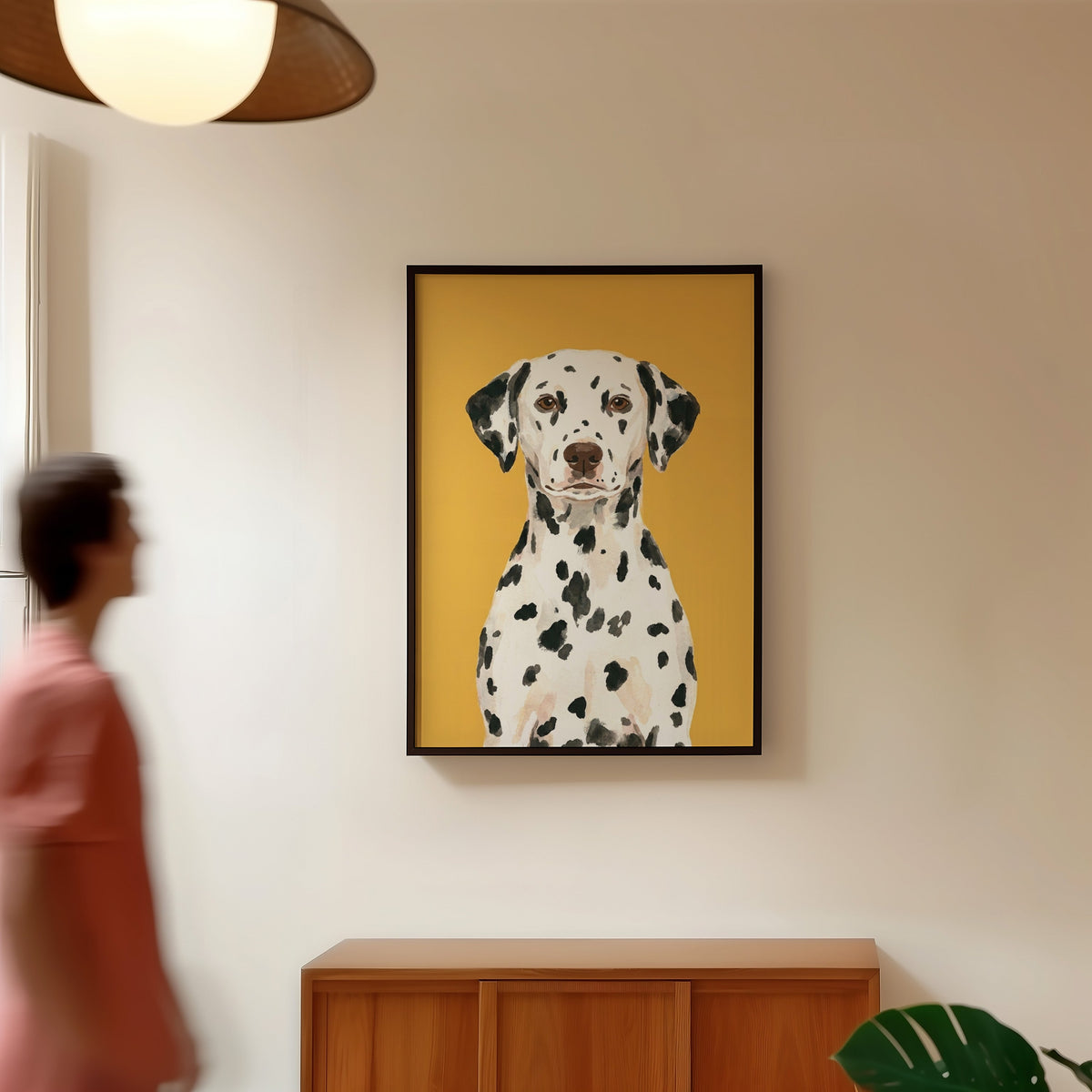 Realistic dog portrait print in a black frame in a hallway under a rattan pendant