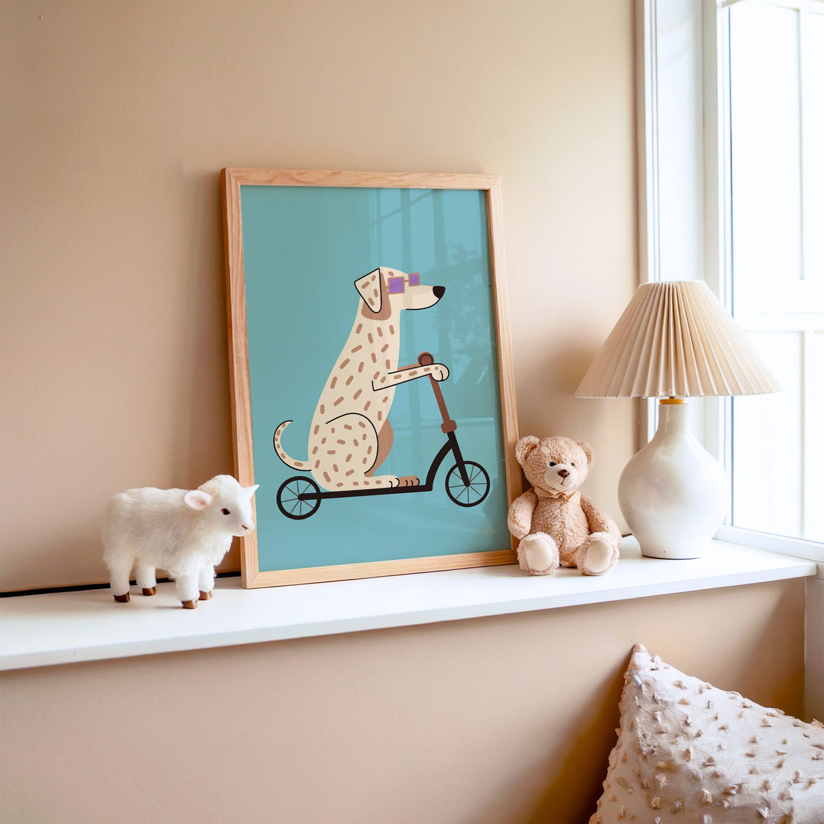 Dalmatian on scooter with purple glasses nursery print in an oak frame on a window ledge with a toy lamb and teddy