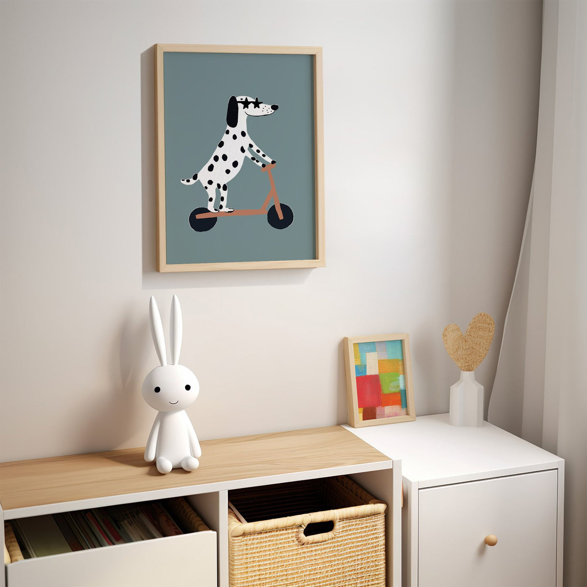 Dalmatian on scooter star glasses nursery print in an oak frame above a kids cubby shelf with a woven basket and bunny lamp