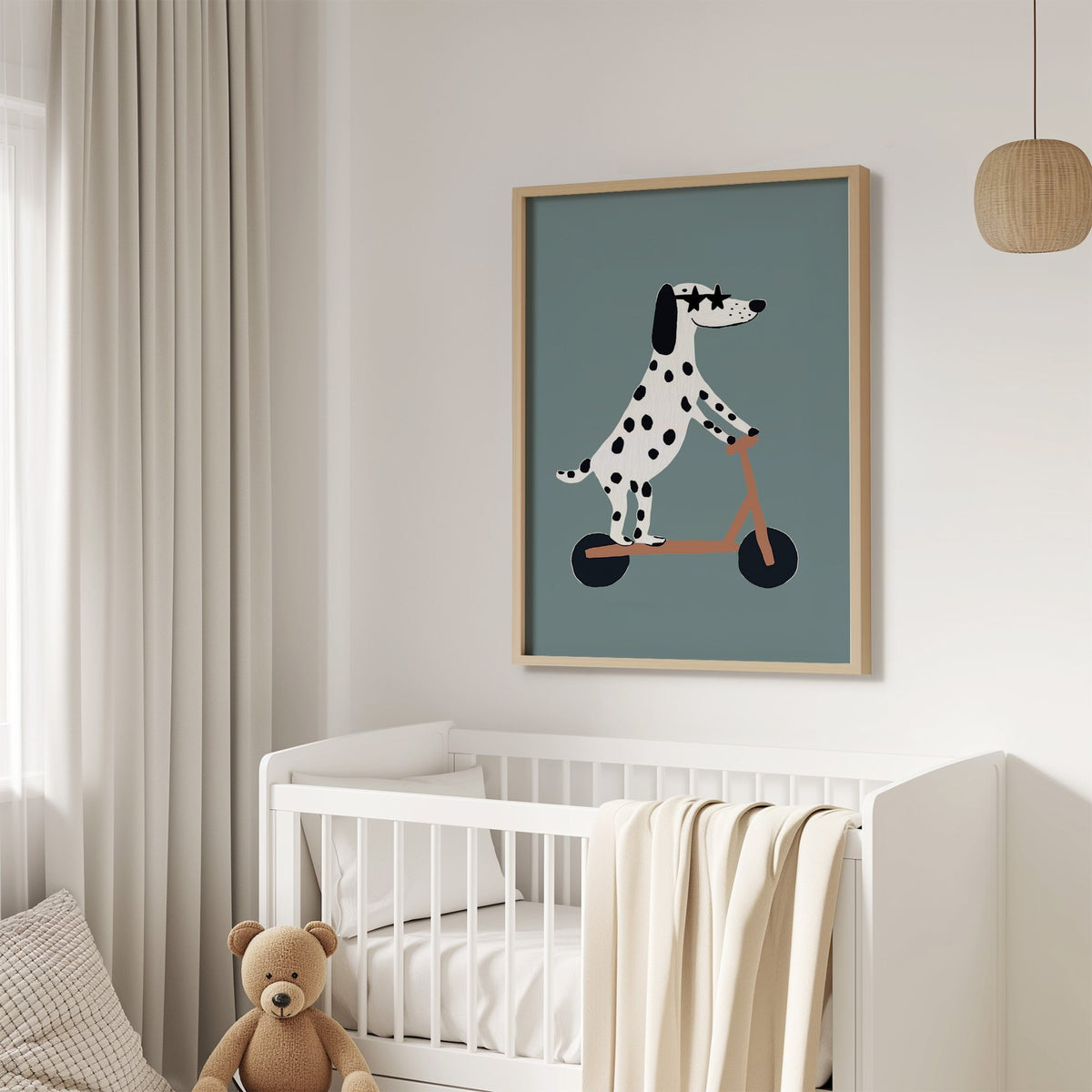 Dalmatian on scooter star glasses nursery print in an oak frame above a white crib with a teddy bear