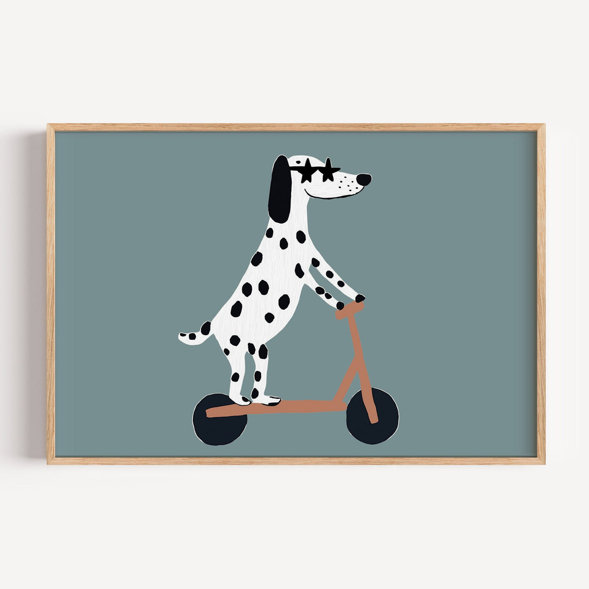 Landscape dalmatian on scooter star glasses nursery print in a light oak frame on a plain white wall