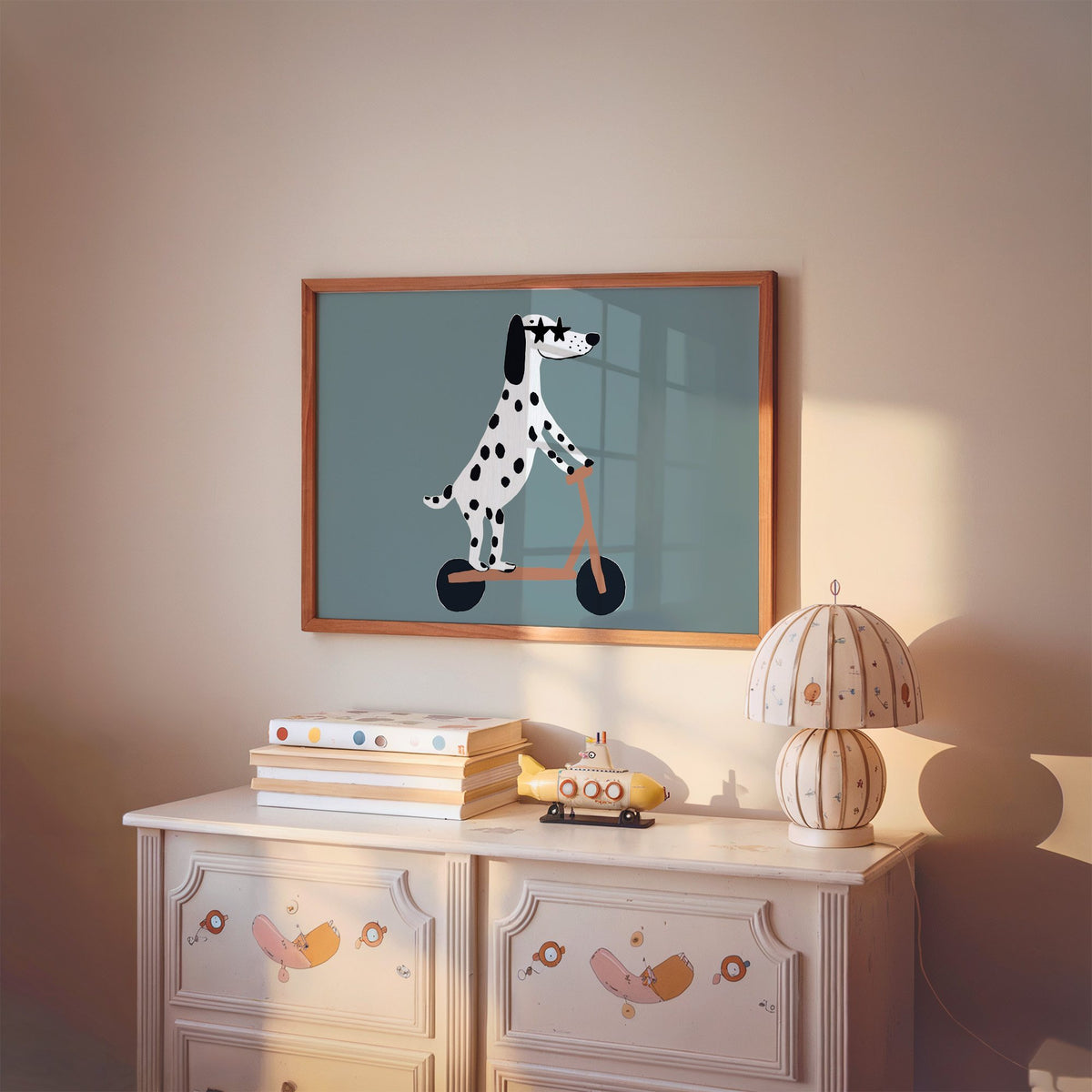 Landscape dalmatian on scooter star glasses nursery print in a cherry wood frame above a painted dresser and lamp