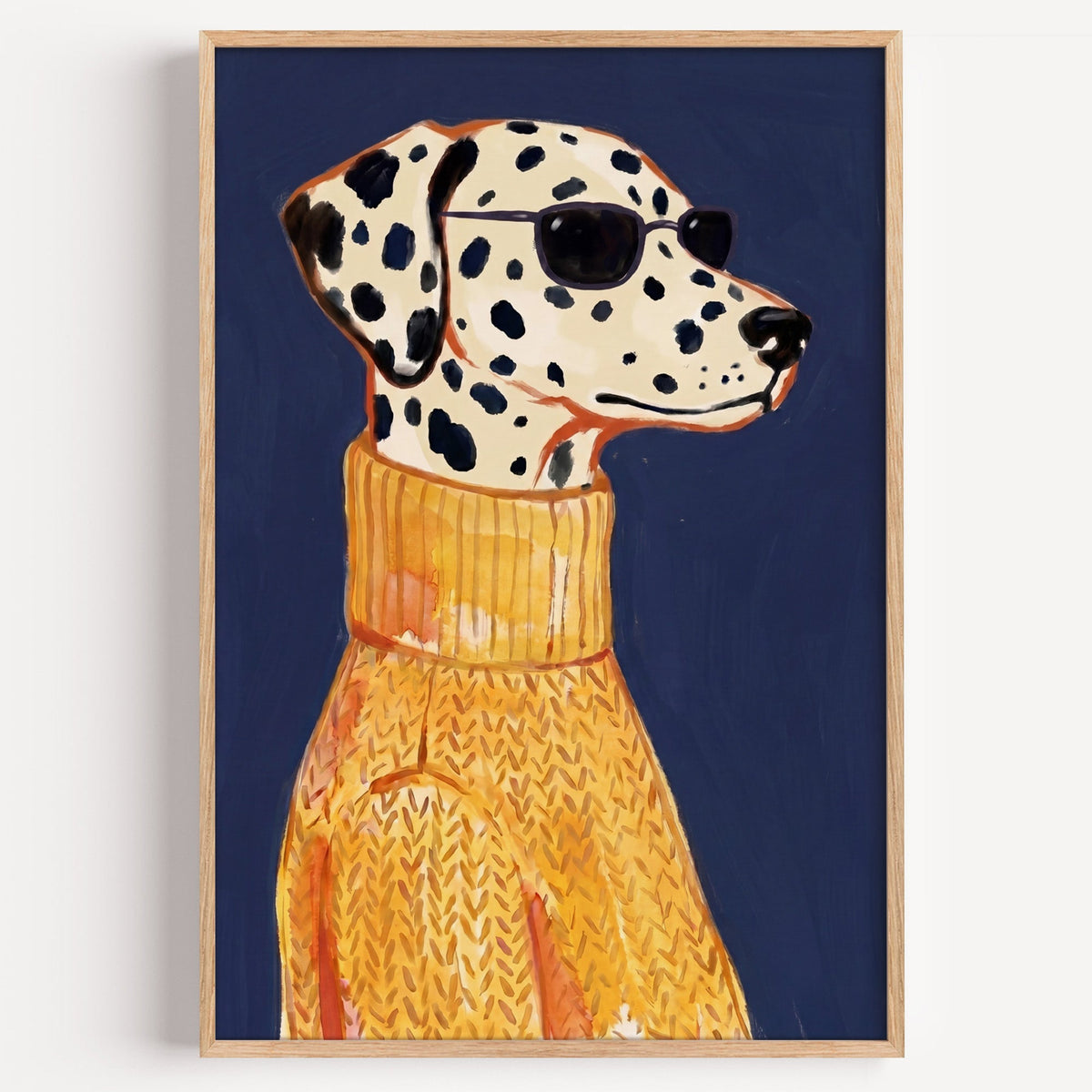 Dalmatian in sunglasses print in a light oak frame on a plain white wall