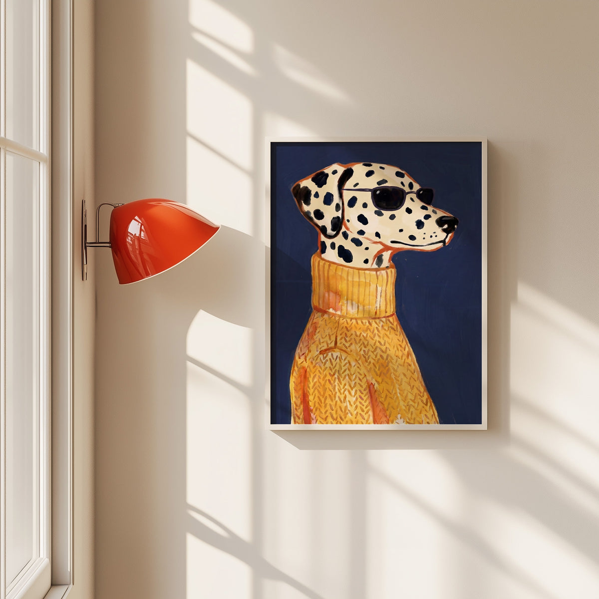 Dalmatian in sunglasses print in a white frame beside a red wall sconce