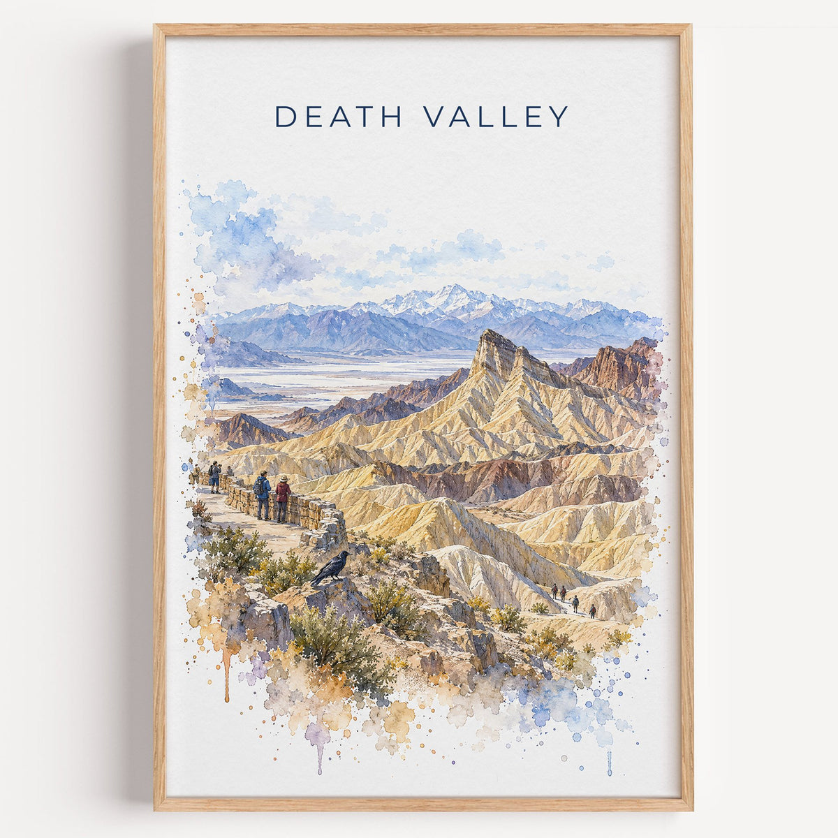 Death Valley National Park watercolor print in a light oak frame on a plain white wall