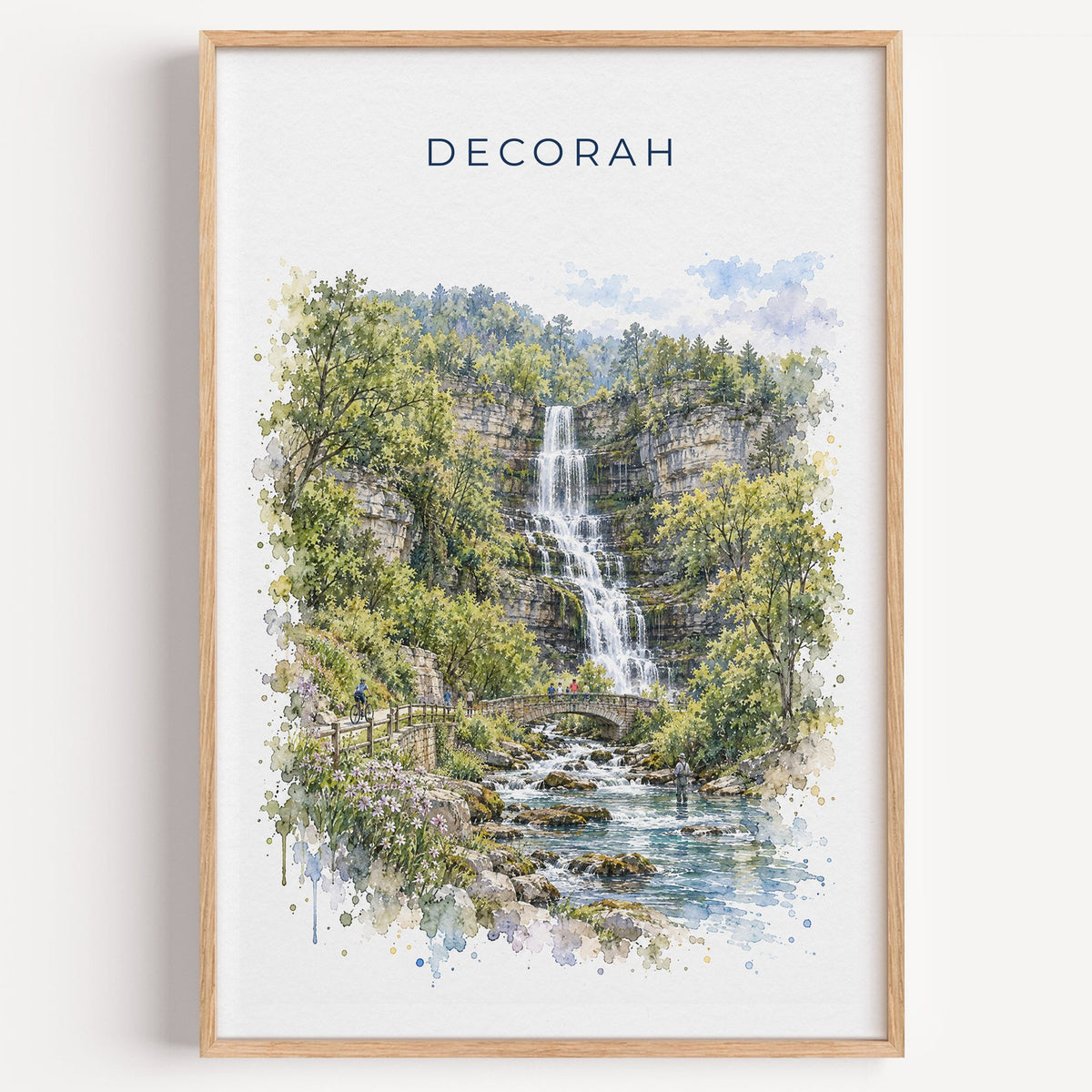 Decorah, Iowa watercolor print in a light oak frame on a plain white wall