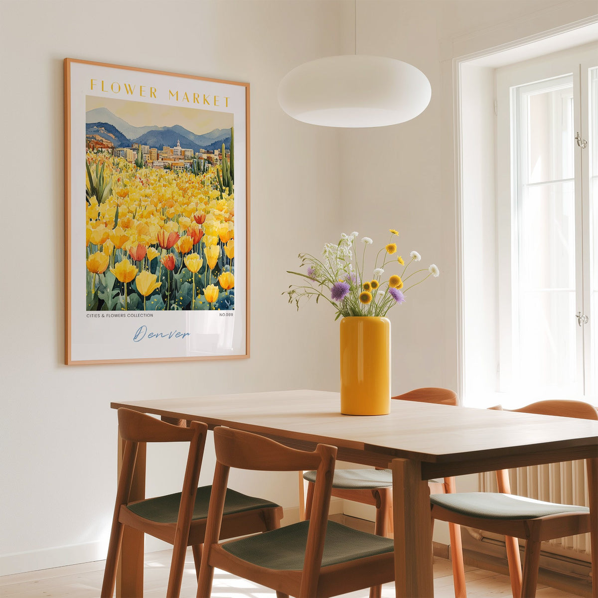 Denver flower market print in an oak frame above a dining table with a yellow vase and white pendant light