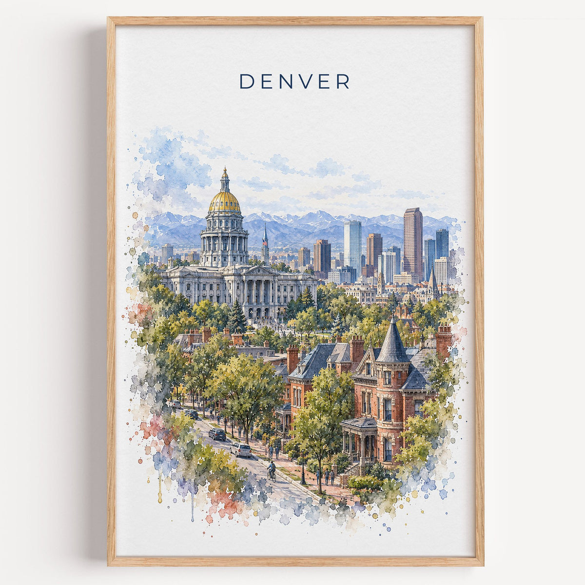 Denver watercolor print in a light oak frame on a plain white wall