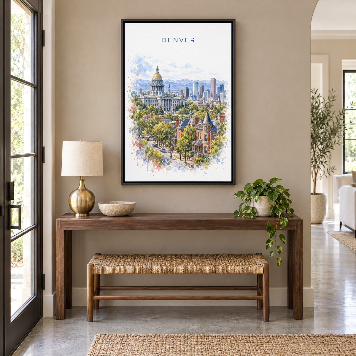 Denver watercolor print as a black floater canvas above a walnut console and woven bench in an entryway