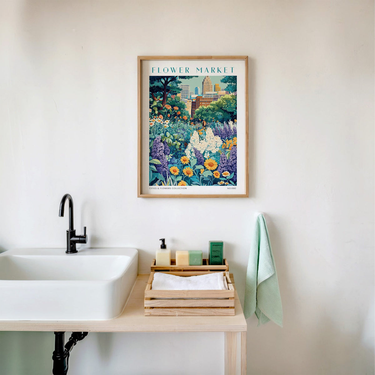 Detroit flower market print in an oak frame above a white bathroom sink with folded towels