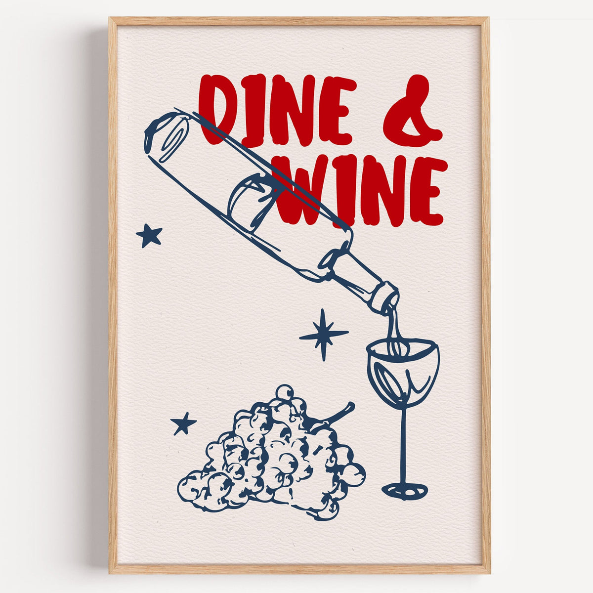 Dine and Wine bottle pour print in a light oak frame on a plain white wall