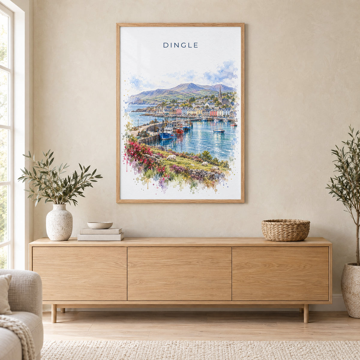 Dingle, Ireland watercolor print in an oak frame above a light wood sideboard in a Scandinavian living room