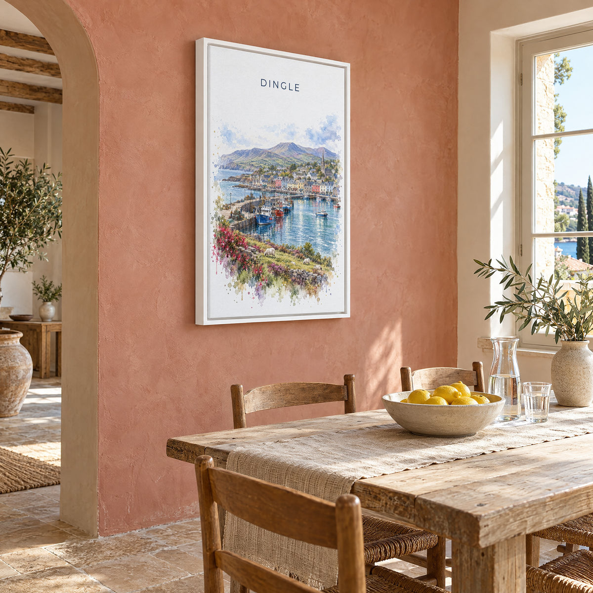 Dingle, Ireland watercolor print as a white floater canvas on a terracotta wall above a rustic dining table