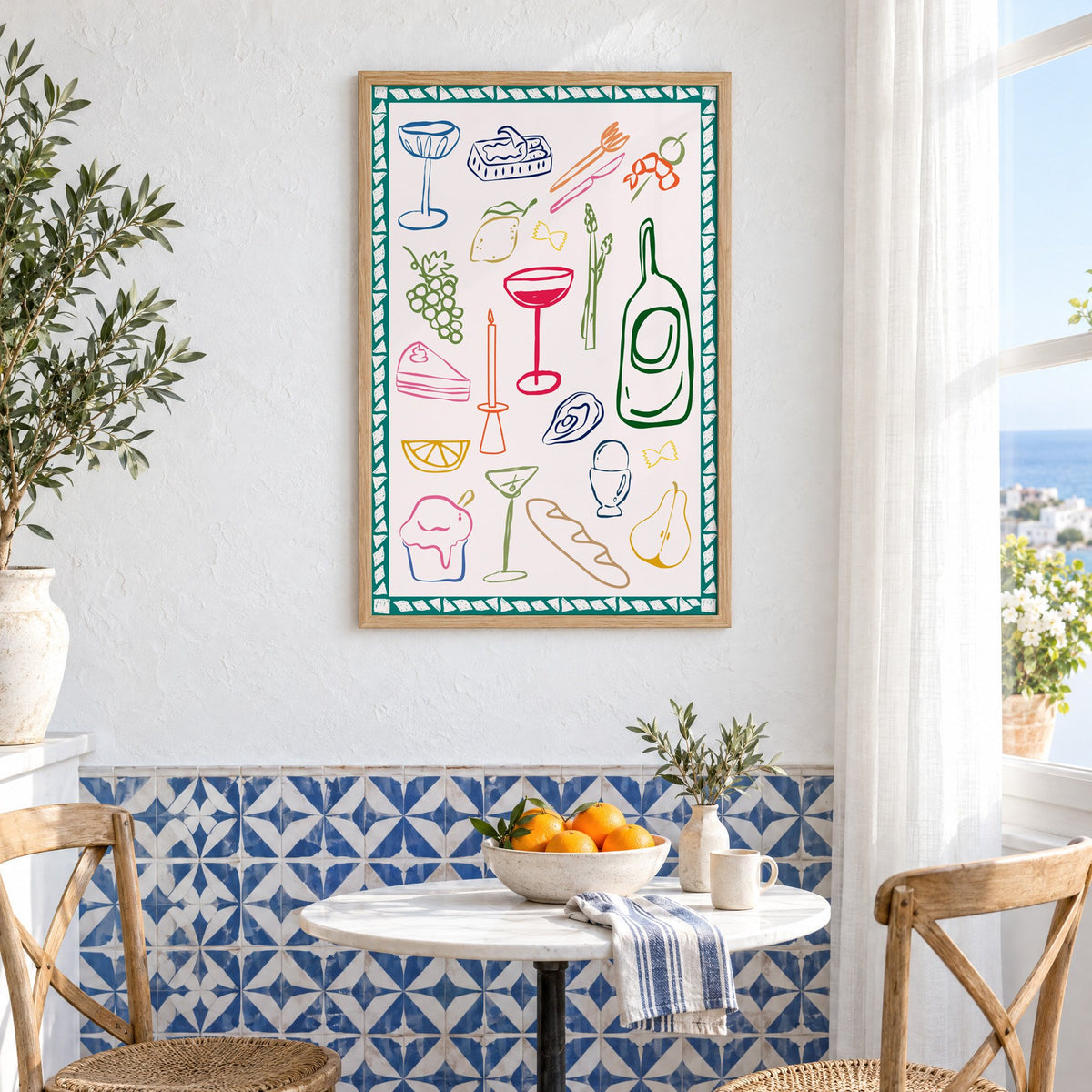 Dinner party doodles teal border print in an oak frame above a bistro table and blue patterned tiles