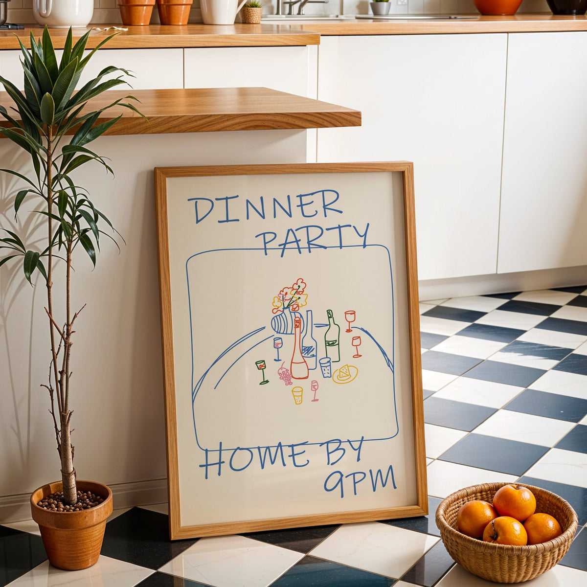 Dinner party blue line print in an oak frame by a kitchen island and checkered floor