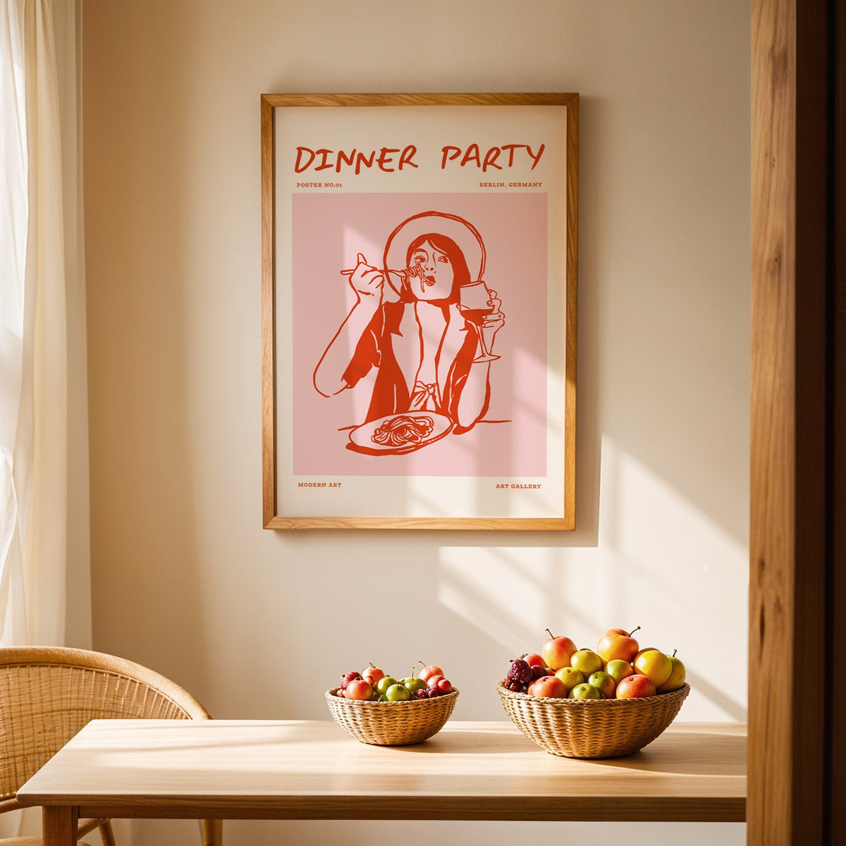 Dinner Party spaghetti print in an oak frame above a dining table with rattan chairs