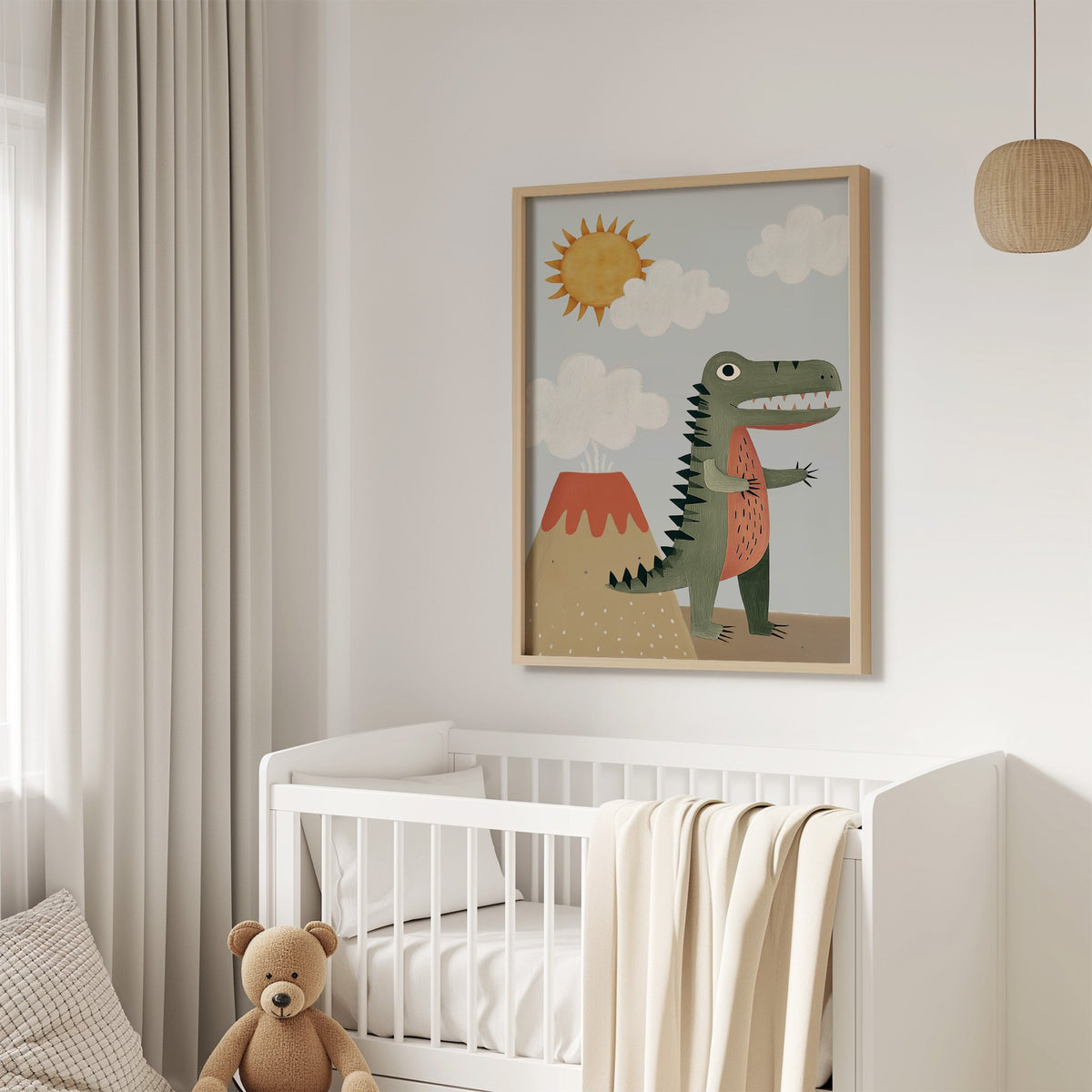 Dinosaur and volcano nursery print in an oak frame above a white crib with a teddy bear