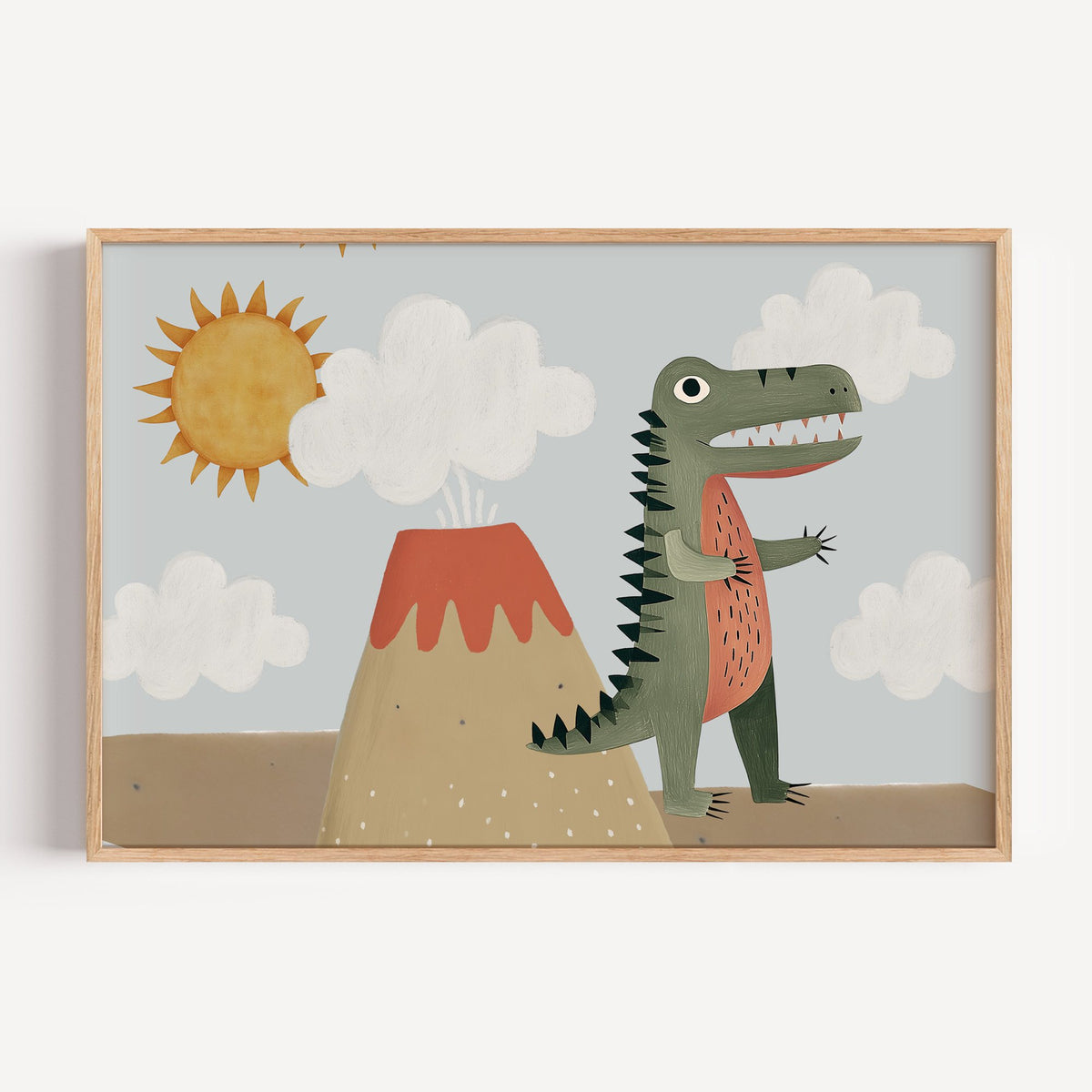 Landscape dinosaur and volcano nursery print in a light oak frame on a plain white wall